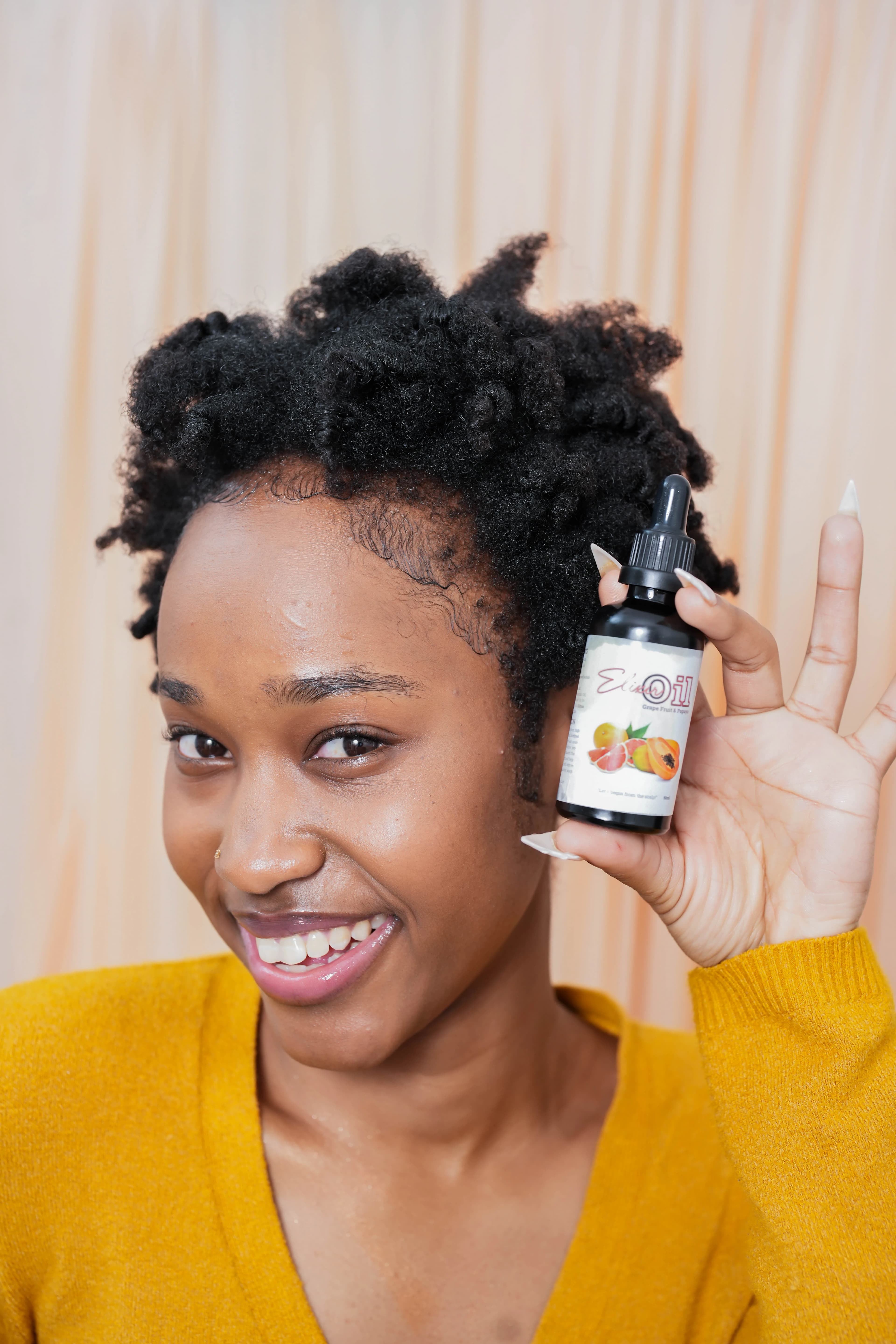Professional product photography of skincare bottles on reflective surface with soft highlights.